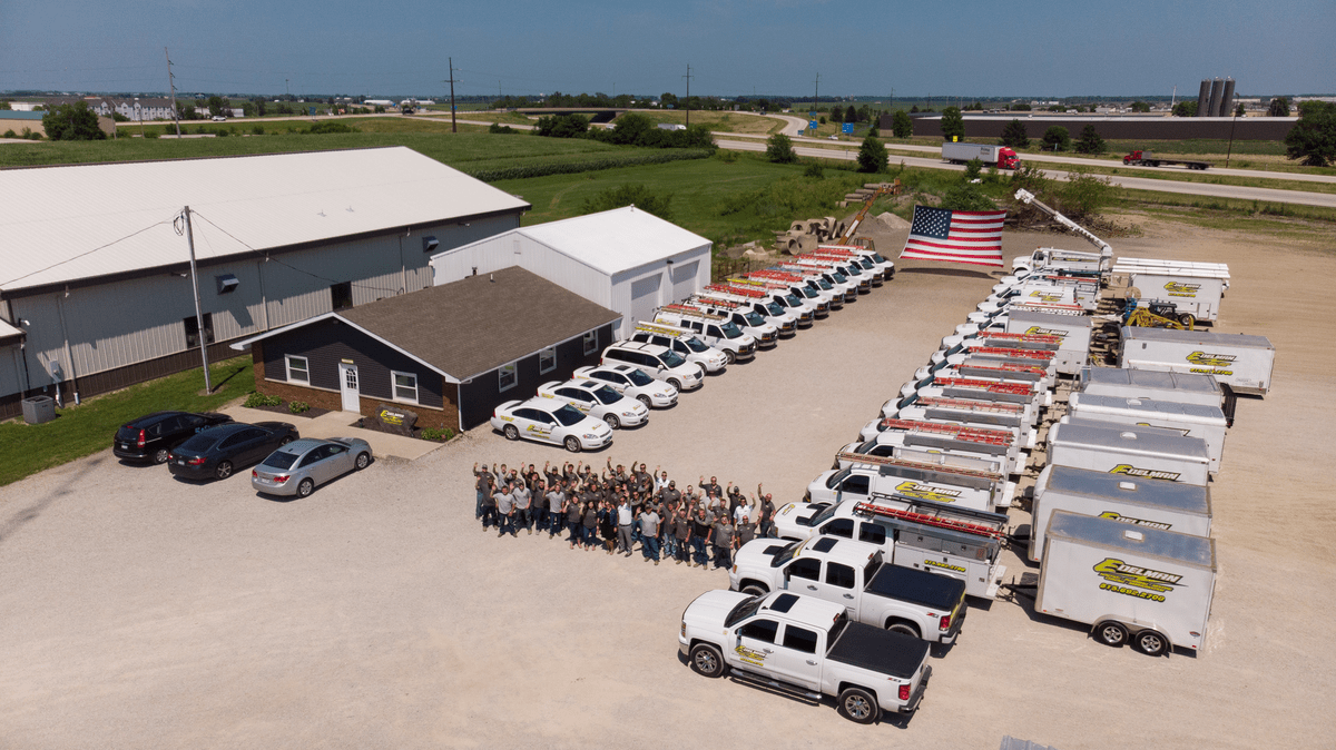 An arial shot of the whole Edelman team and fleet of trucks.